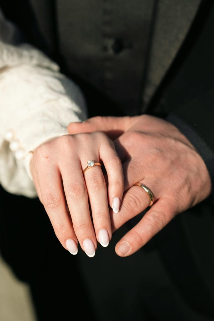 Jeweller showing different wedding ring widths and profiles on a tray