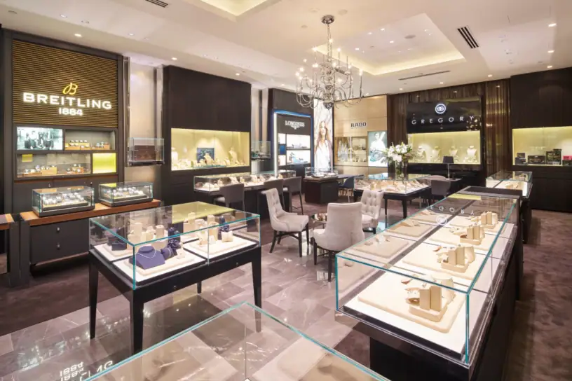 Luxurious jewellery store interior showcasing elegant display cases and high-end brands.